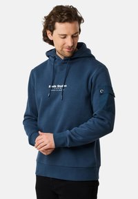 Felpa blu con coulisse, dotata di un logo sul petto e di una toppa in tessuto a contrasto sulla manica sinistra. Morbida al tatto, stile a pullover.