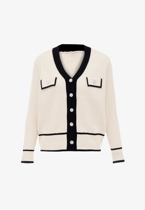 Crème cardigan met marineblauwe accenten, geribbelde textuur, V-hals, twee voorzakken en decoratieve knopen met bloemmotieven.