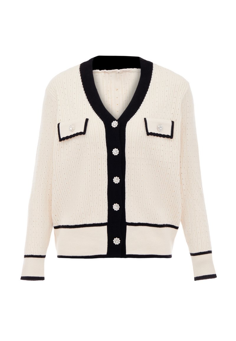 Krém színű kardigán sötétkék díszítéssel, bordázott textúrával, V-nyakkal, két elülső zsebbel és virágmintás dekoratív gombokkal.