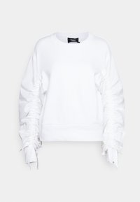 Vit sweatshirt med volangärmar, rundad halsringning och ribbad nederkant. Har en mjuk textur och minimal logotyp på bröstet.