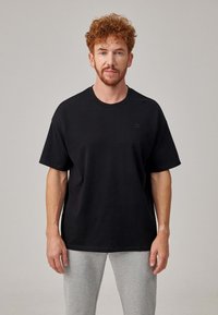 SNOCKS T-shirt basic - schwarz