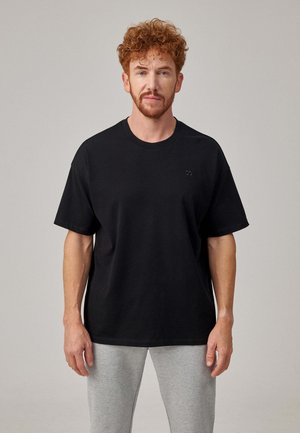 T-shirt basique - schwarz