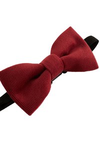 Raudonas kordurovinis kaklaraištis su tekstūruotu paviršiumi, turintis centrinį mazgą ir reguliuojamą juodą dirželį. Tinka oficialioms progoms.