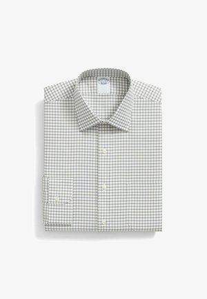 Witte overhemdd met een klein ruitpatroon in grijs en marineblauw. Met kraag, lange mouwen en knoopmanchetten, keurig gevouwen.