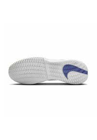 Semelle de chaussure de sport blanche avec une surface texturée, mettant en avant un accent violet. Conçue avec un motif de traction en zigzag pour une meilleure adhérence.