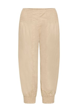 Heledadbežased püksid, millel on korvivöö, lahtine lõige ja elastsed mansetid. Valmistatud sileda ja kergest materjalist.