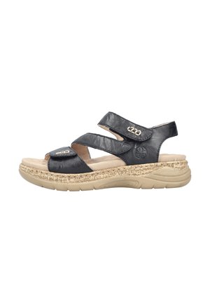 Sandales noires en cuir avec deux brides croisées réglables, une semelle intérieure rembourrée et une semelle beige texturée pour un meilleur maintien et confort.