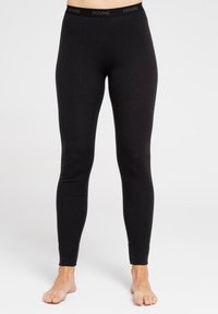 Sorte leggings lavet af et glat, strækbart materiale. Har en talje med "DOVRE"-logoet og en tætsiddende design ned til anklerne.