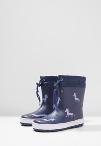 Marina gummistövlar med rosa enhörningsmönster, justerbar dragsko högst upp och vit sula, med texturerat grepp för bra fäste.