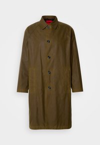 Olive green waterproof overcoat with a straight cut, button closure, side pockets, and a collared neckline. Features a smooth texture.