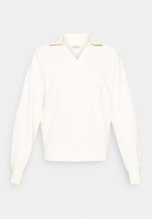 Sweat-shirt blanc à col en V et col court. Il présente des manches longues légèrement bouffantes et des bords côtelés au bas.