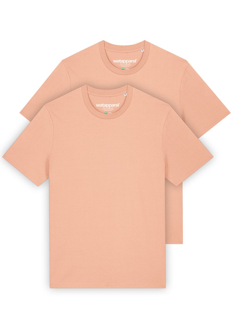 Twee t-shirts met korte mouwen in een zachte perzikkleur. Gemaakt van gladde stoffen, met ronde halslijnen en een minimalistischer ontwerp.