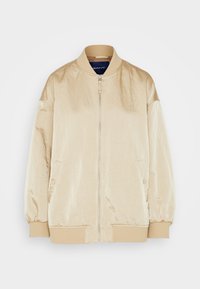 Chaqueta bomber beige hecha de un tejido suave y brillante. Cuenta con un cierre frontal de cremallera, cuello y puños acanalados, y bolsillos laterales. Diseño simple sin patrones.