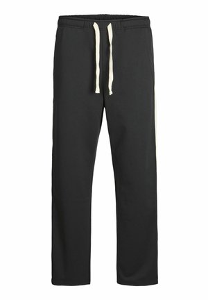 Sorte sweatpants lavet af blødt stof, med en snøre i taljen og hvide sidenstriber langs de ydre sømme. Glat struktur hele vejen igennem.