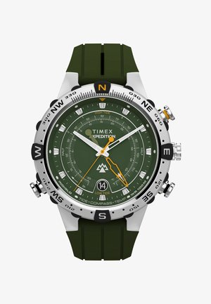 Orologio Timex Expedition con cinturino in gomma verde, cassa argentata, quadrante verde scuro, dettagli arancioni, bussola e indicatori di marea. Design durevole.