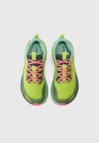 Running shoes in bright green mesh with pink laces, black accents, and textured rubber sole. Lightweight design with a padded collar.