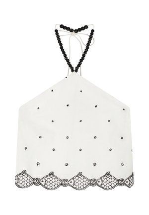 White halter top with black bead straps, small black embroidered dots, and a black embroidered fish pattern along the scalloped hem.