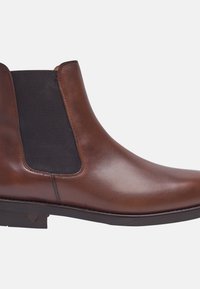 Bruine leren Chelsea-boot met elastische zijkanten, ronde neus, gladde textuur en lage rubberen hak. Minimale stikseldetails.
