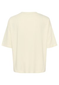 T-shirt à manches courtes, col rond en blanc cassé, fabriqué en tissu doux. Présente une coupe décontractée avec un ourlet droit et sans éléments de design supplémentaires.
