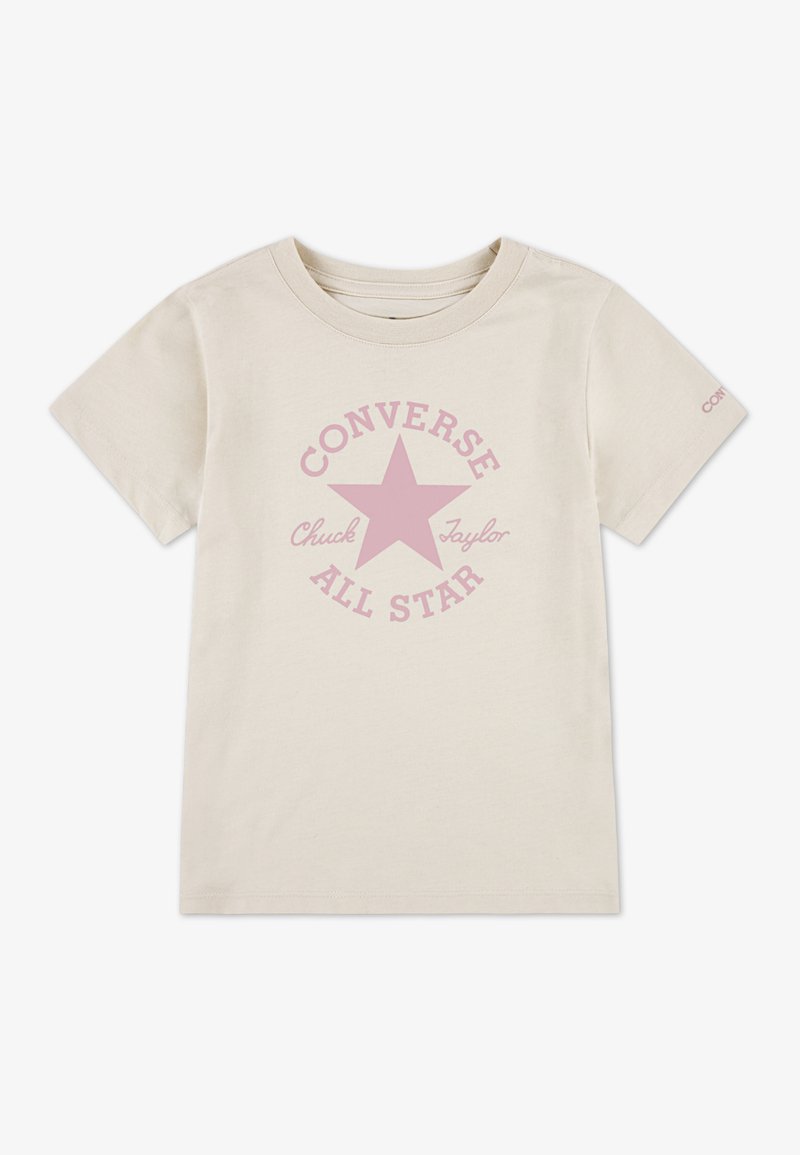 Světlé béžové bavlněné tričko s růžovou hvězdou a kruhovým nápisem "CONVERSE" a "Chuck Taylor". Krátké rukávy, kulatý výstřih.