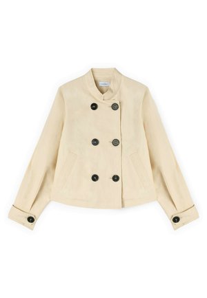 Beige croppet jakke med høj krave, seks sorte knapper foran, to sidelommer og manchetter med knapper på de lange ærmer.