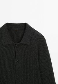 Dark gray knitted cardigan with a ribbed texture, button front, and a collared neckline. Soft fabric and a relaxed fit.
