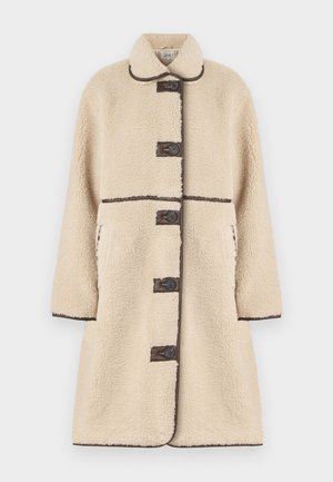 Κρέμας φούτερ παλτό με χαλαρή εφαρμογή, κουμπωτό μπροστινό μέρος, καφέ λεπτομέρειες και δύο πλευρικές τσέπες. Διαθέτει γιακά και υφή υφάσματος.