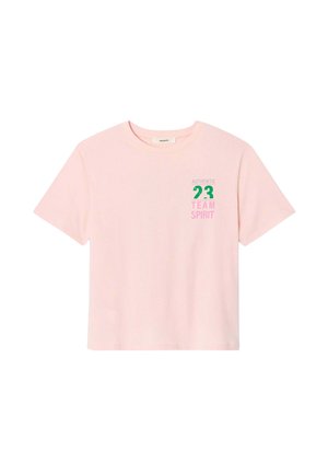 T-shirt en coton rose à manches courtes, avec une impression graphique verte et rose portant "AUTHENTIC 23 TEAM SPIRIT" à l'avant.