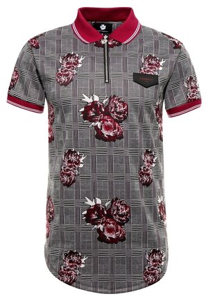 Polo met korte mouwen met een geruit patroon en rode bloemaccenten. Ritssluiting, zwarte kraag en een zwart label op de linkerborst.