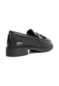 Black leather loafers with a flat, textured sole, tassel detailing on the toe, and a smooth finish on the upper.