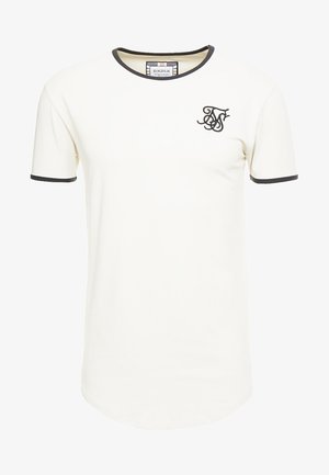 Cremefarbenes T-Shirt mit kurzen Ärmeln, schwarzem, geripptem Rundhalsausschnitt und Ärmelbündchen. Mit einem kleinen schwarzen Logo auf der linken Brustseite.