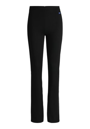 Musta venyvä housut, joissa on istuva muotoilu, keski-mallinen vyötärö ja pieni logo sivussa. Silkkinen tuntuma, kapeat suorat lahkeet.