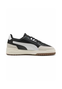 Black and white athletic sneakers with a leather and suede upper, featuring a rubber sole, textured accents, and a low-top design.