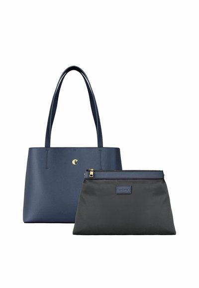 Torba tote mornarsko modre barve z dolgimi ročaji in malim zlatim emblemom, združena s črno torbico z zadrgo, mornarskimi robovi in tkanim etiketom.