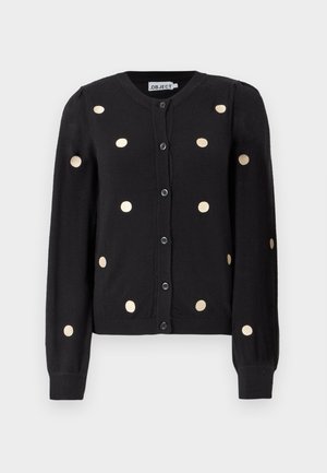 Cardigan nero con bottoni e maniche lunghe, caratterizzato da grandi pois beige distribuiti uniformemente e polsini e orlo a costine.
