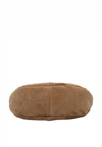 Ruskea mokkainen pyöreä tyyny, jossa on sileä pinta, saumassa ommeltuja yksityiskohtia ja tasainen pinnan muotoilu.