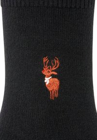 Calze nere lavorate a maglia con un renna arancione ricamato e le corna, rifinite con un accento bianco sul collo.