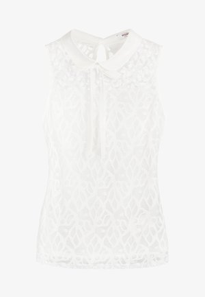 Blouse blanche sans manches avec un col, présentant un motif en dentelle florale transparente et un détail de nœud à l'encolure.