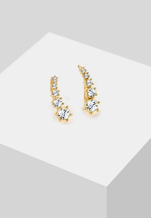 Goldene Ohrringe mit einem gestuften Design, verziert mit mehreren klaren Kristallsteinen, die eine schlanke, verlängerte Form und ein schimmerndes Finish präsentieren.