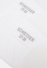 White socks made of soft fabric with gray branding "SCHIESSER" and size "37-38" printed on them. Features a smooth texture and subtle design.