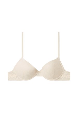 Beige Spitzen-BH mit vorgeformten Cups, verstellbaren Trägern und einem Hakenverschluss auf der Rückseite. Ein strukturiertes Muster verziert den Stoff.