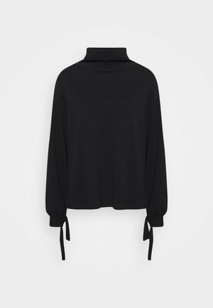 Stickad tröja - black