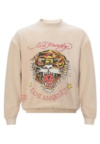 Sudadera beige con un audaz estampado gráfico de tigre en amarillo, negro y rojo, con el texto "Ed Hardy" y "Los Ángeles" en una fuente estilizada.