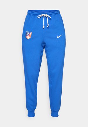 Blaue Sweatpants aus weichem Stoff mit einem elastischen Bund und Zugband, einem Logopatch und gerippten Beinabschlüssen.