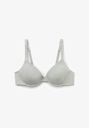 Soutien-gorge rembourré gris en matériau doux avec des bretelles ajustables, des bonnets sans coutures et une texture lisse. Pas de matériel ou de motifs visibles.