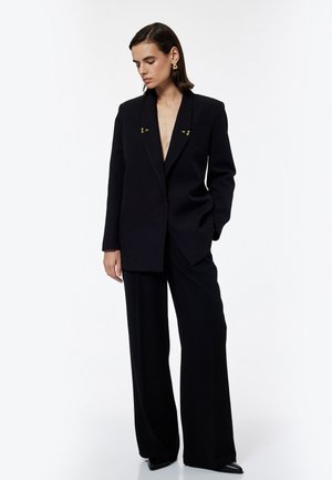 Pantalones - black