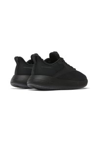 Black athletic shoes featuring a textured mesh upper and a ridged rubber outsole. The design includes a padded collar and logo accents.