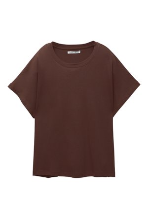 Braunes Oversize-T-Shirt aus Baumwolle, mit Rundhalsausschnitt, kurzen Ärmeln und einer lockeren Passform. Glatte Textur ohne sichtbare Muster.