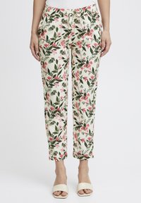 Pantalons fleuris avec une base crème, ornés de motifs botaniques roses et verts, dotés d'une taille élastique et d'une coupe décontractée.