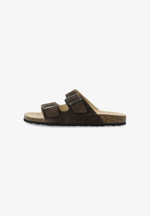 Braune Wildleder-Sandalen mit zwei verstellbaren Riemen, einem Korkfußbett und einer strukturierten schwarzen Gummisohle. Flaches Design für angenehmes Tragen.